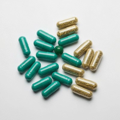 Assortment of sleep aid supplements, including melatonin and herbal capsules, on a clean, light background